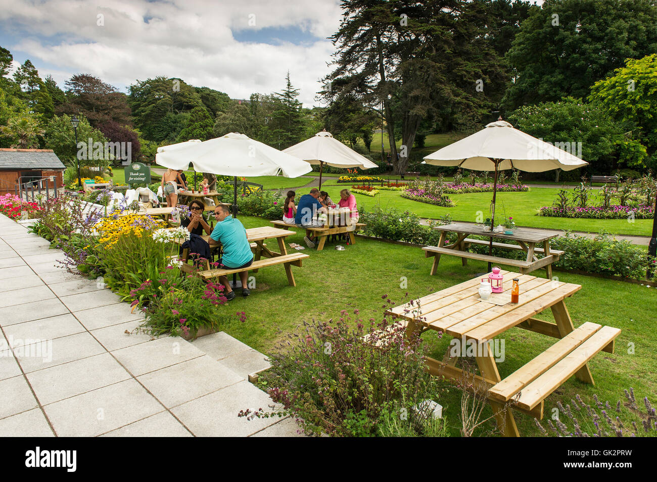 Customers relaxing in Wilton’s Tea Room in Trenance Gardens in Newquay, Cornwall. Stock Photo