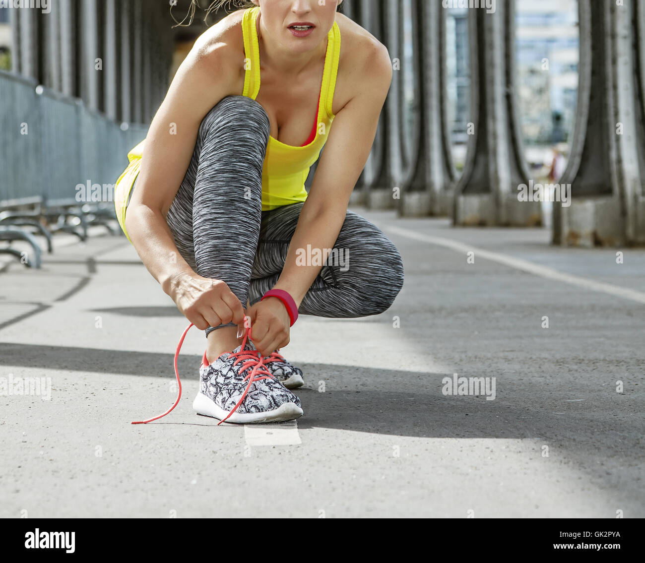 Outdoors Fitness In Paris Young Woman Jogger Tying