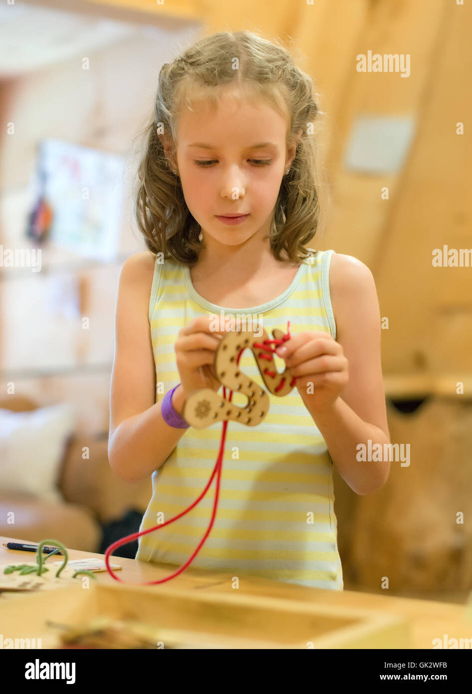 Little girl playing with educational toy Stock Photo - Alamy