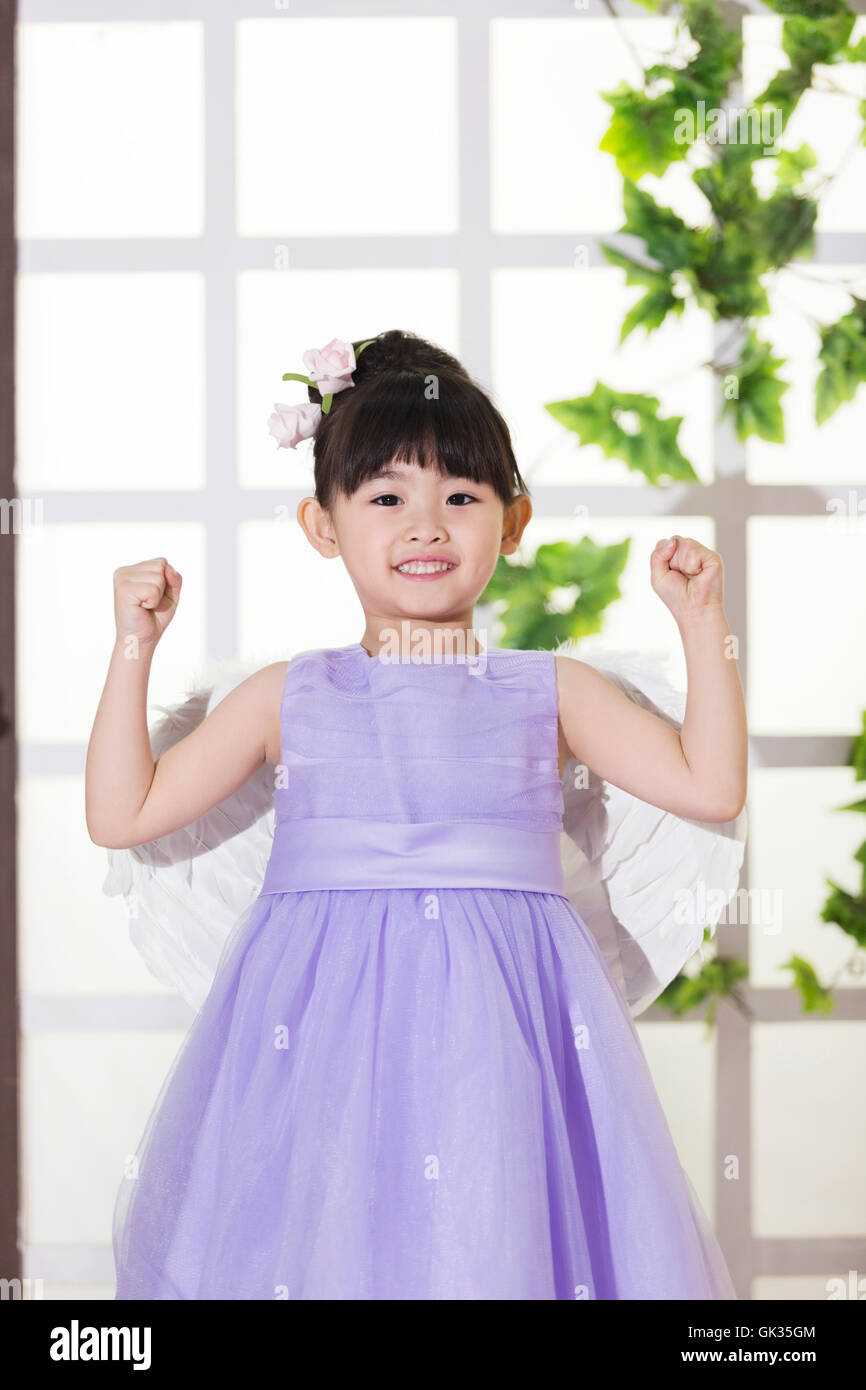 Cute little girl wearing the dress Stock Photo - Alamy