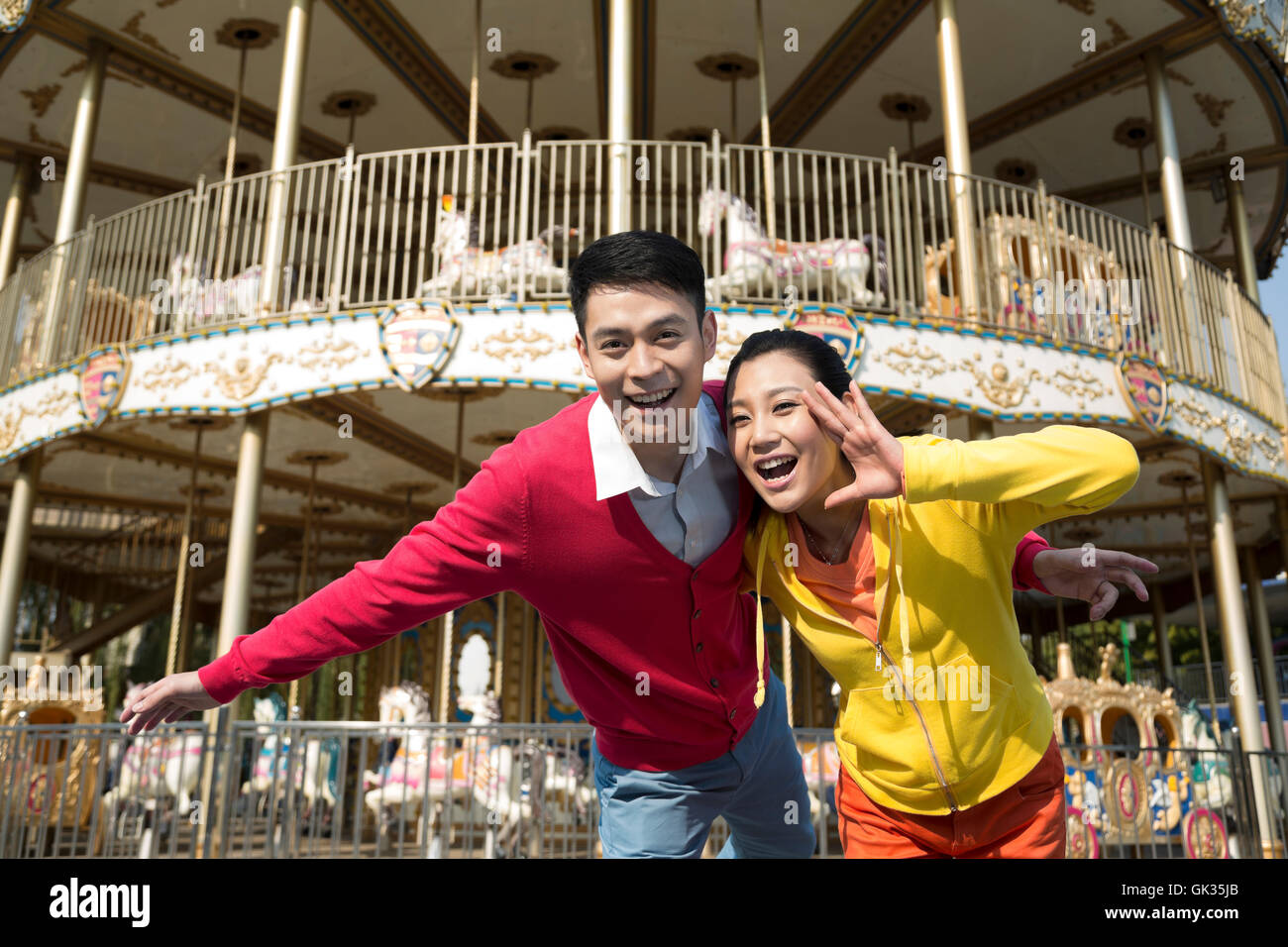 Young couple went to the amusement park Stock Photo - Alamy
