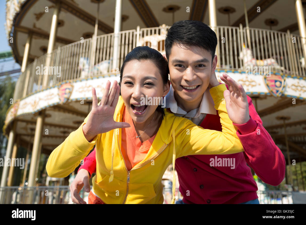 Young couple went to the amusement park Stock Photo - Alamy