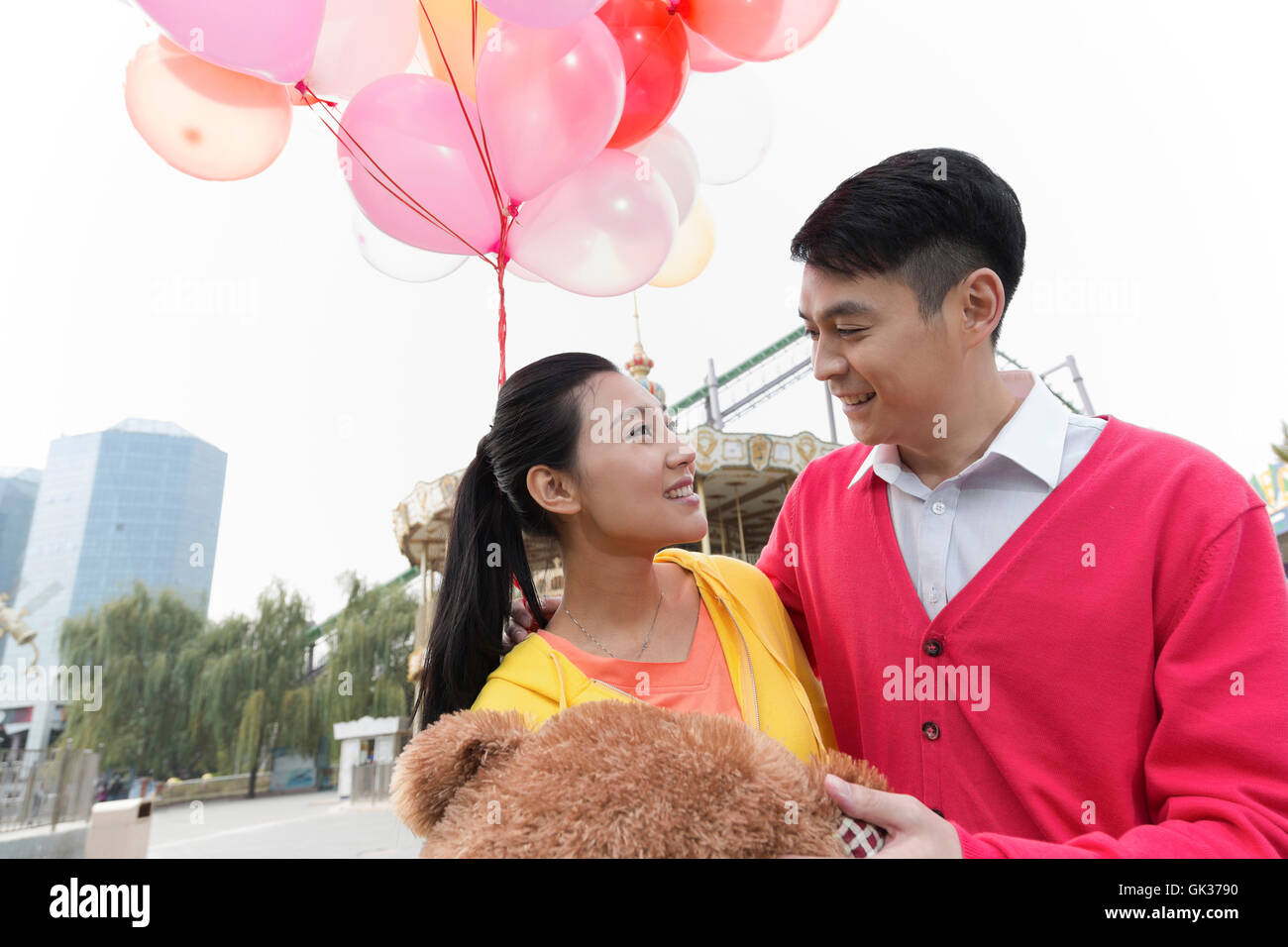 Young couple went to the amusement park Stock Photo