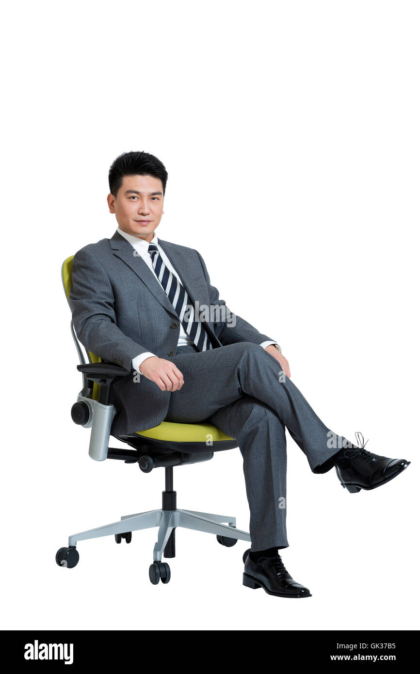 Studio shot business men sitting on office chair Stock Photo - Alamy