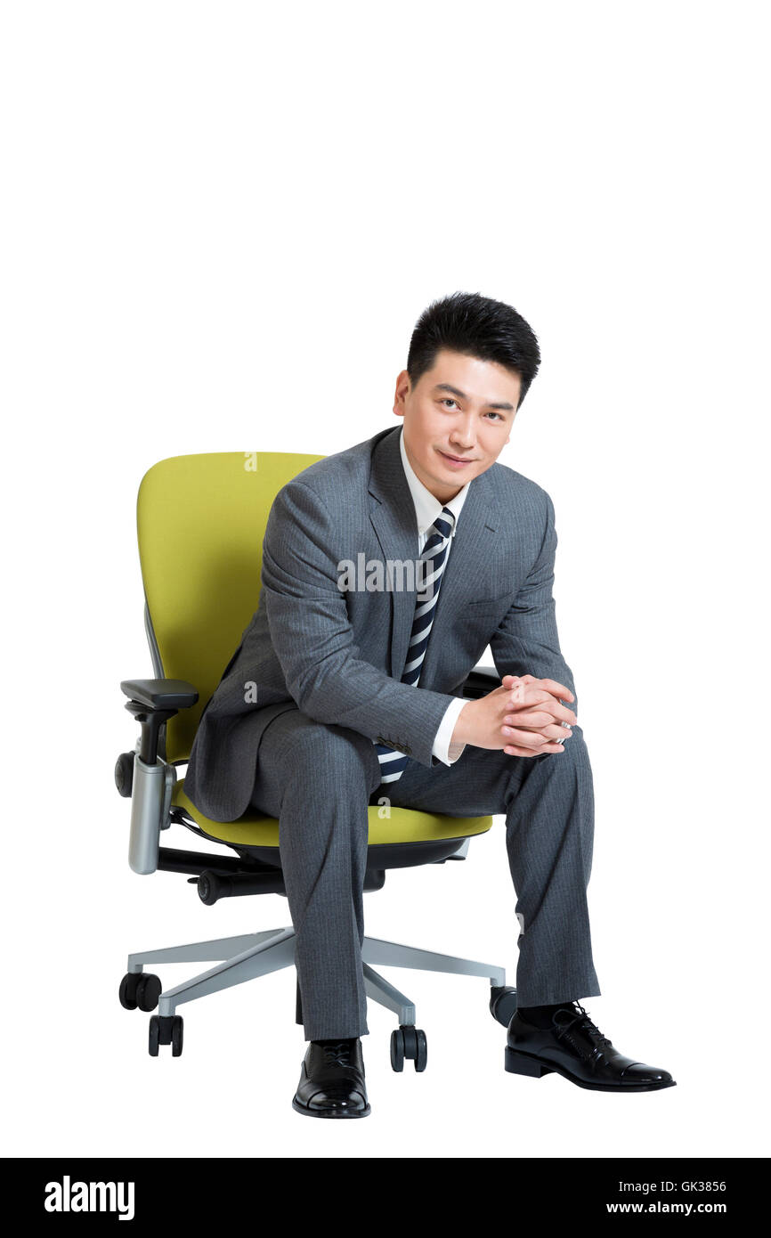 Studio shot business men sitting on office chair Stock Photo - Alamy