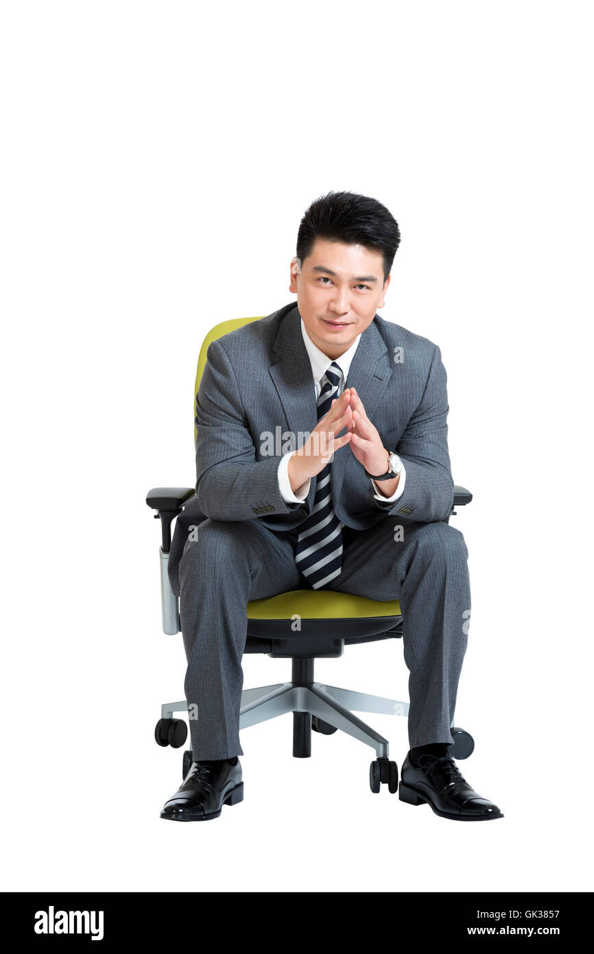 Studio shot business men sitting on office chair Stock Photo - Alamy