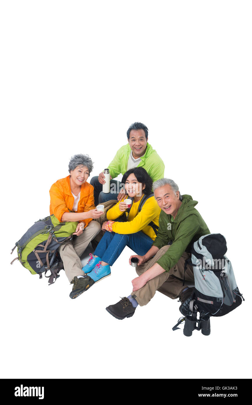 Four elderly people sitting together rest Stock Photo