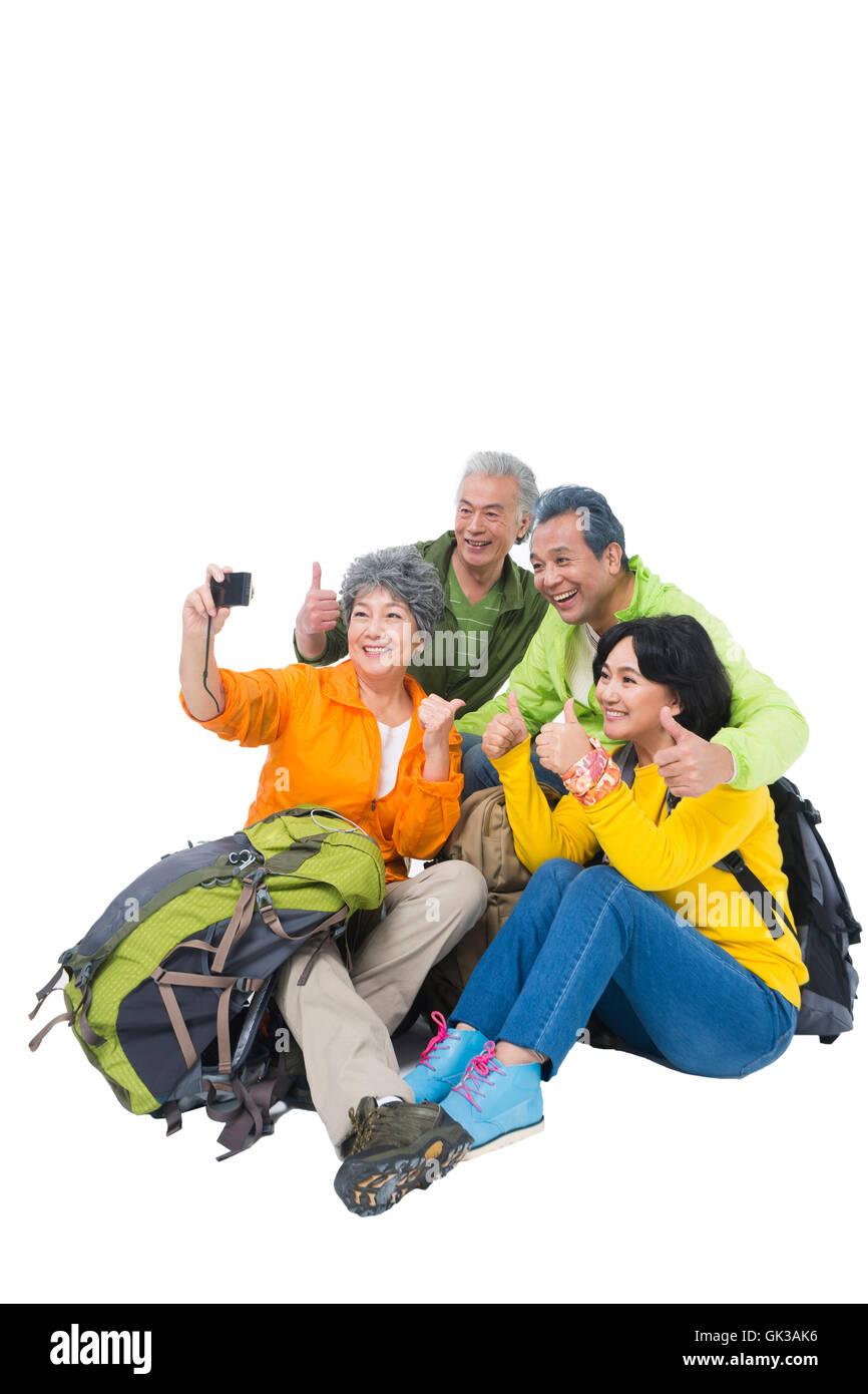 Four elderly people sitting together rest Stock Photo