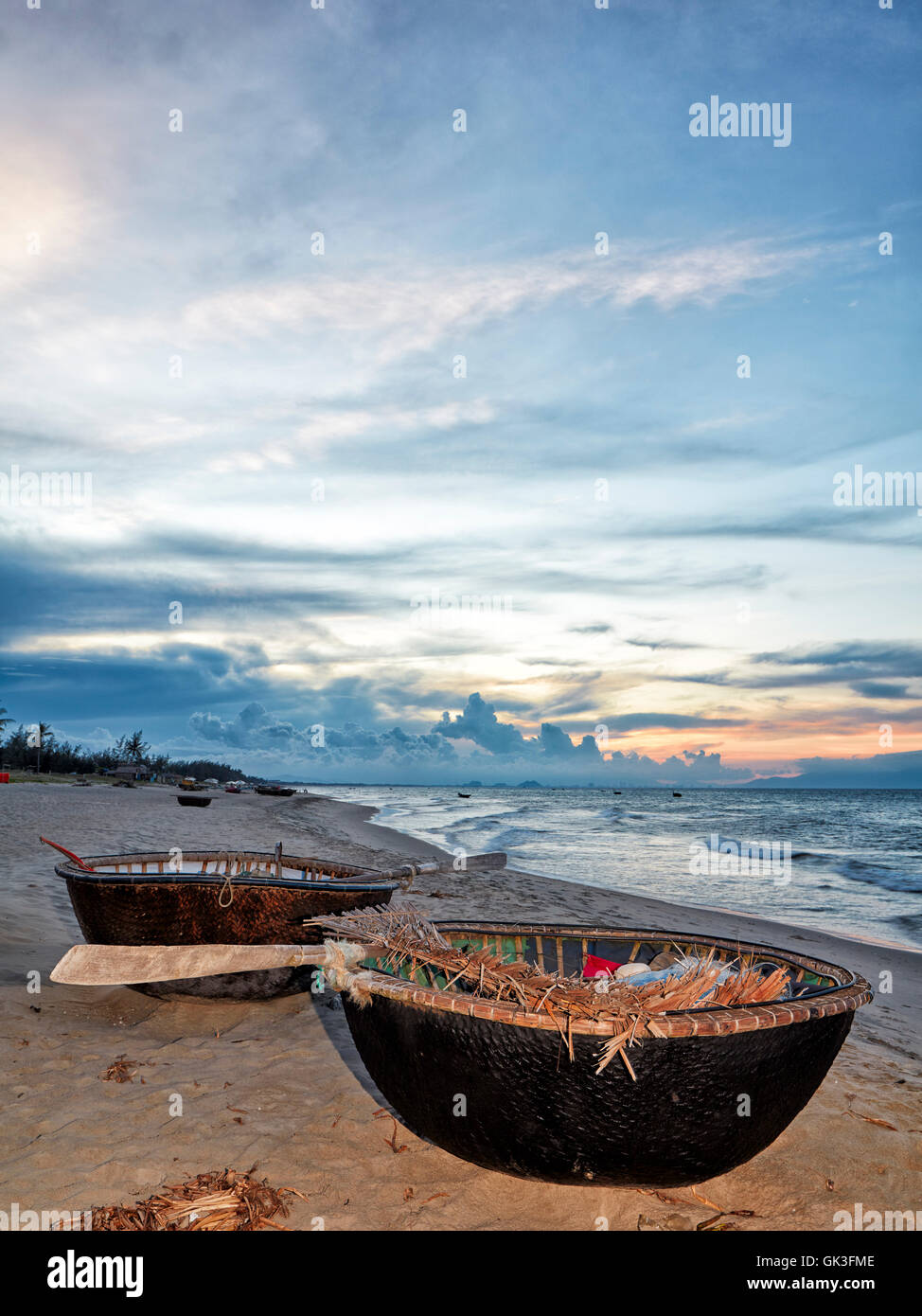 Traditional Vietnamese coracles at Cua Dai Beach at dusk. Hoi An, Quang Nam Province, Vietnam