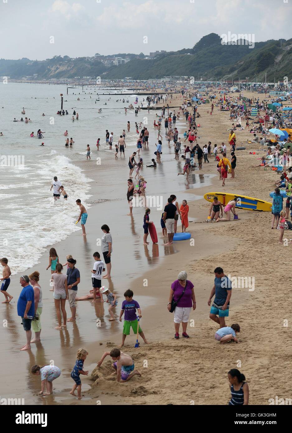 Members of the public gather on Bournemouth beach to enjoy the first day of this year's Bournemouth Air Festival. Stock Photo