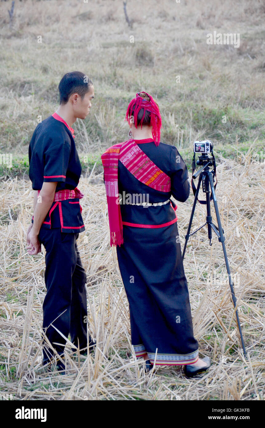 Lovers phu tai people join and use camera for take photo in phu thai world day festival at Ban Non Hom in dusk time on January 1 Stock Photo