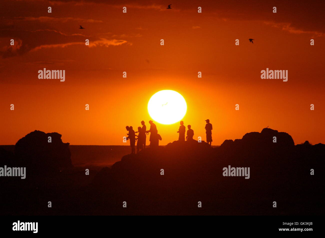 setting sun teens teenagers Stock Photo