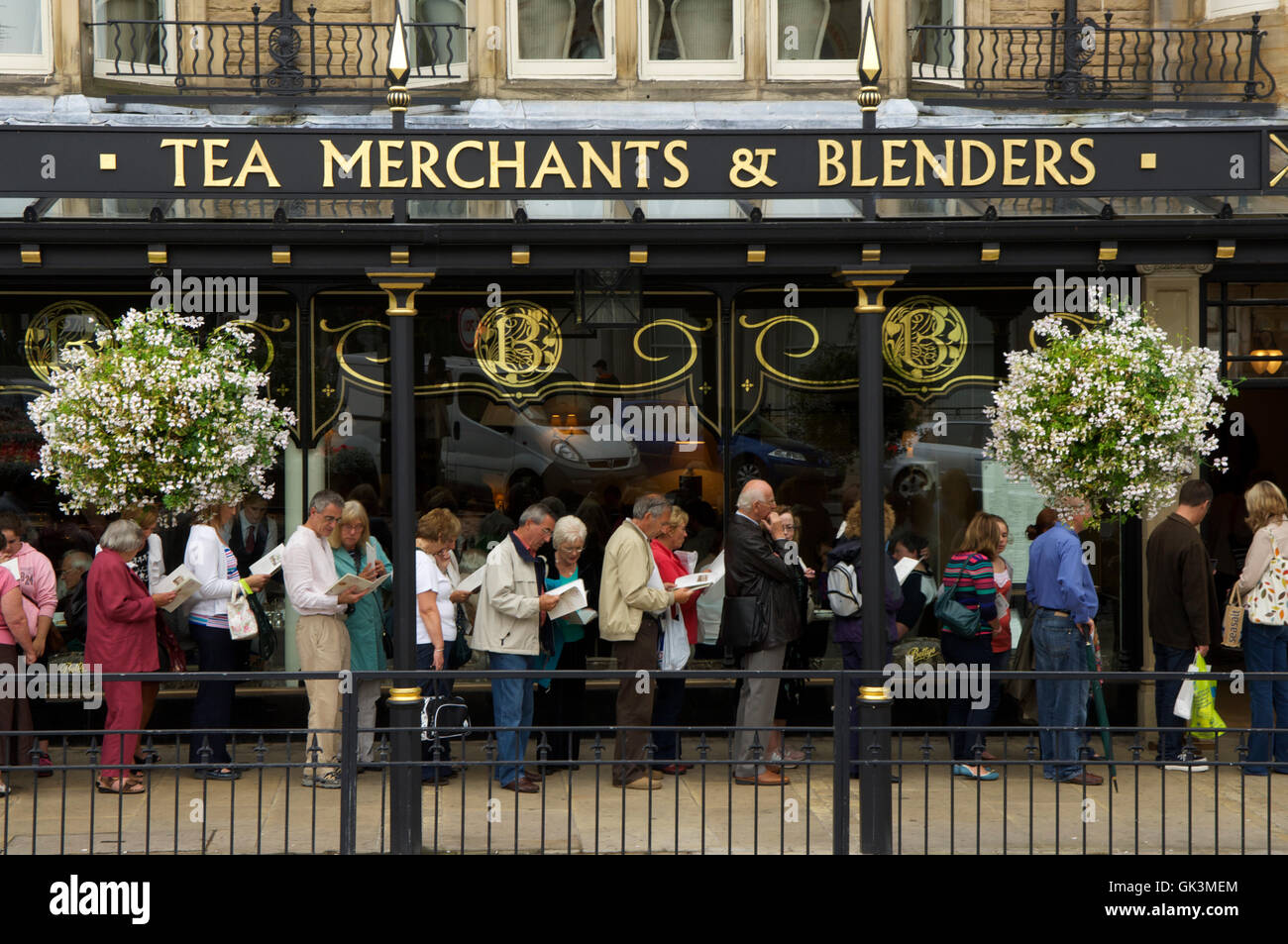12 Aug 2011, Harrogate, North Yorkshire, England, UK --- Queue for afternoon tea, outside Betty's in Harrogate, England, UK --- Stock Photo