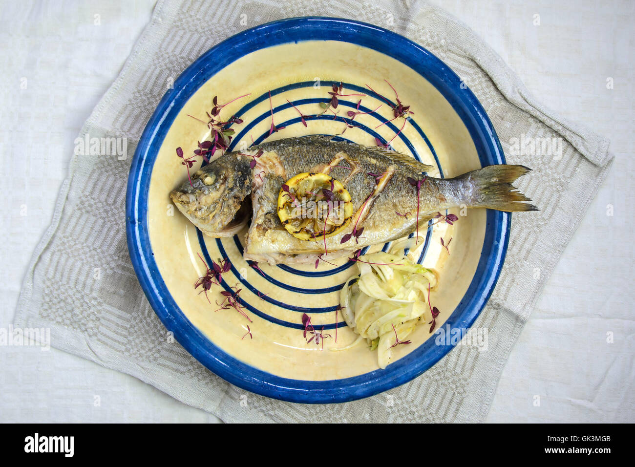 Roasted fish with lemon Stock Photo