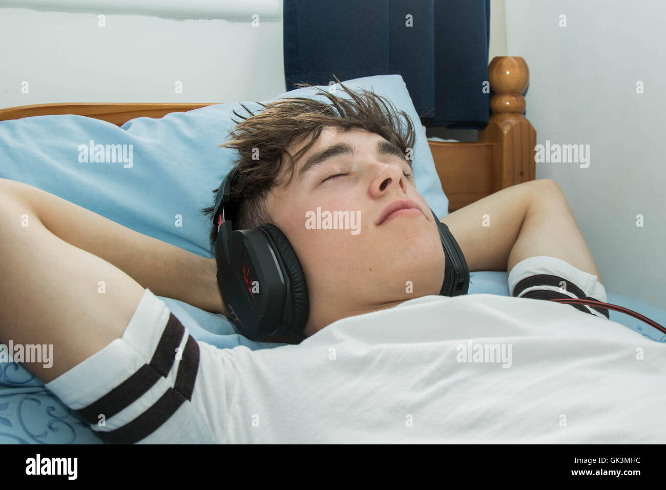 Teenage boy listening to music Stock Photo