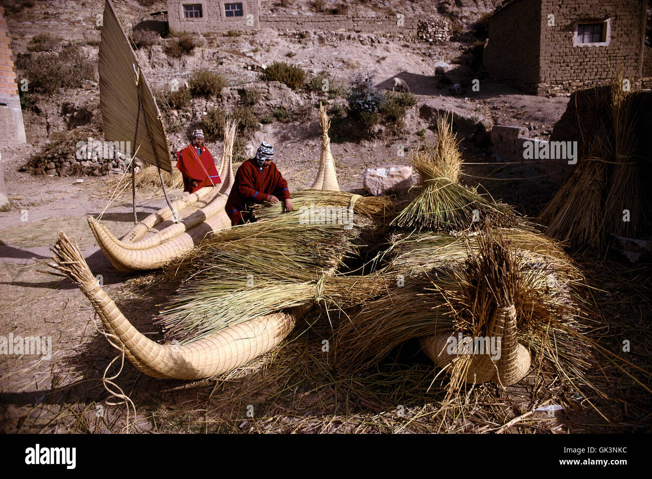 Tconstruct Reeds ca. 2003, Bolivia --- Boatbuilders construct caballitos out of reeds on ...