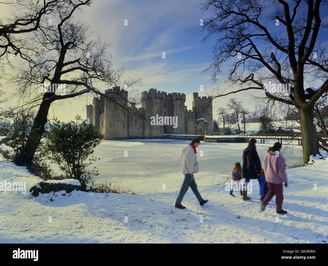 A family taking a winter walk at Bodiam Castle. Sussex. England. UK Stock Photo