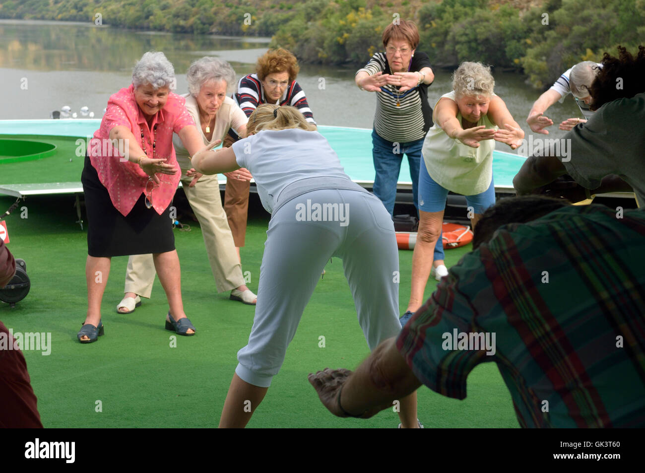 Stretching exercise class on the deck of Douro valley cruise ship ...