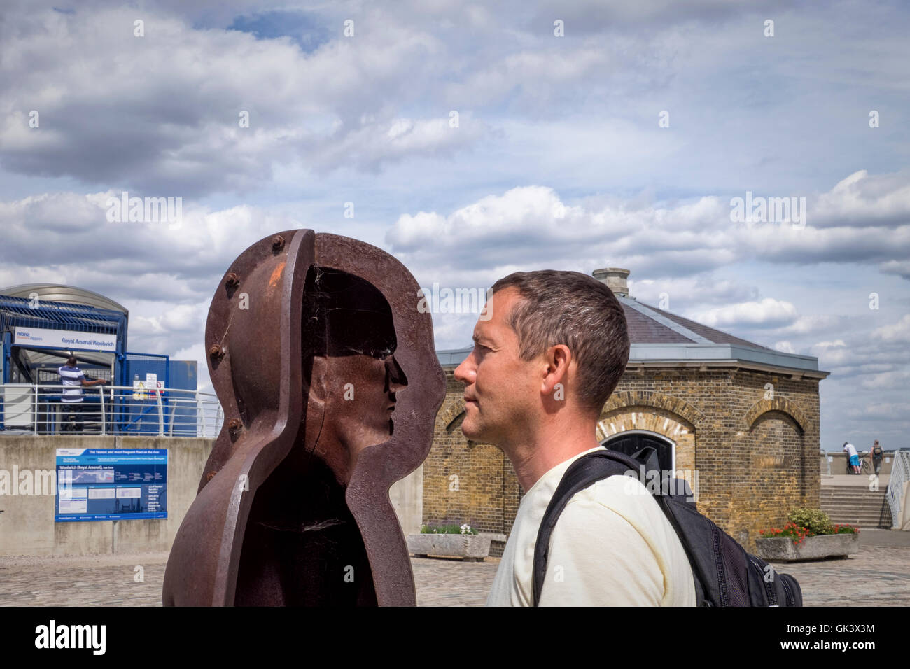 Woolwich, London.Royal Arsenal Riverside. Young man mimics Sculpture ...