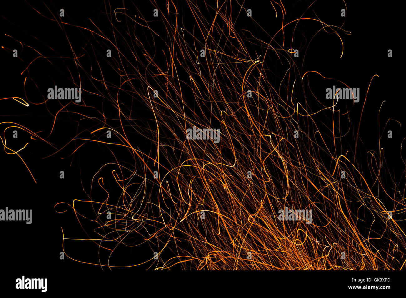 Dancing flames and sparks isolated on black Stock Photo - Alamy
