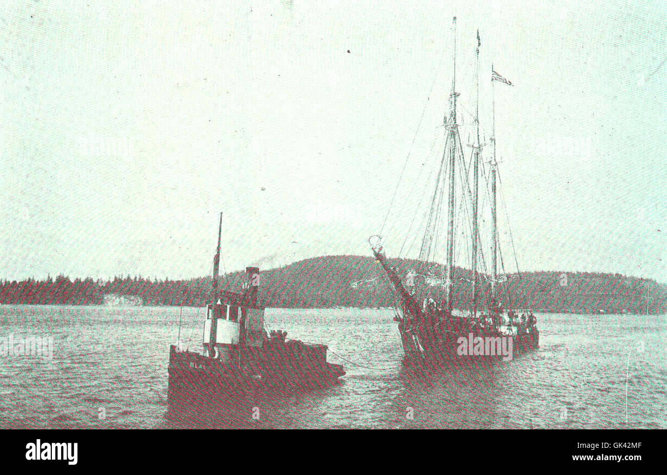 The schooner Joseph Russ, owned by the Robinson Codfish Co, is depicted ...