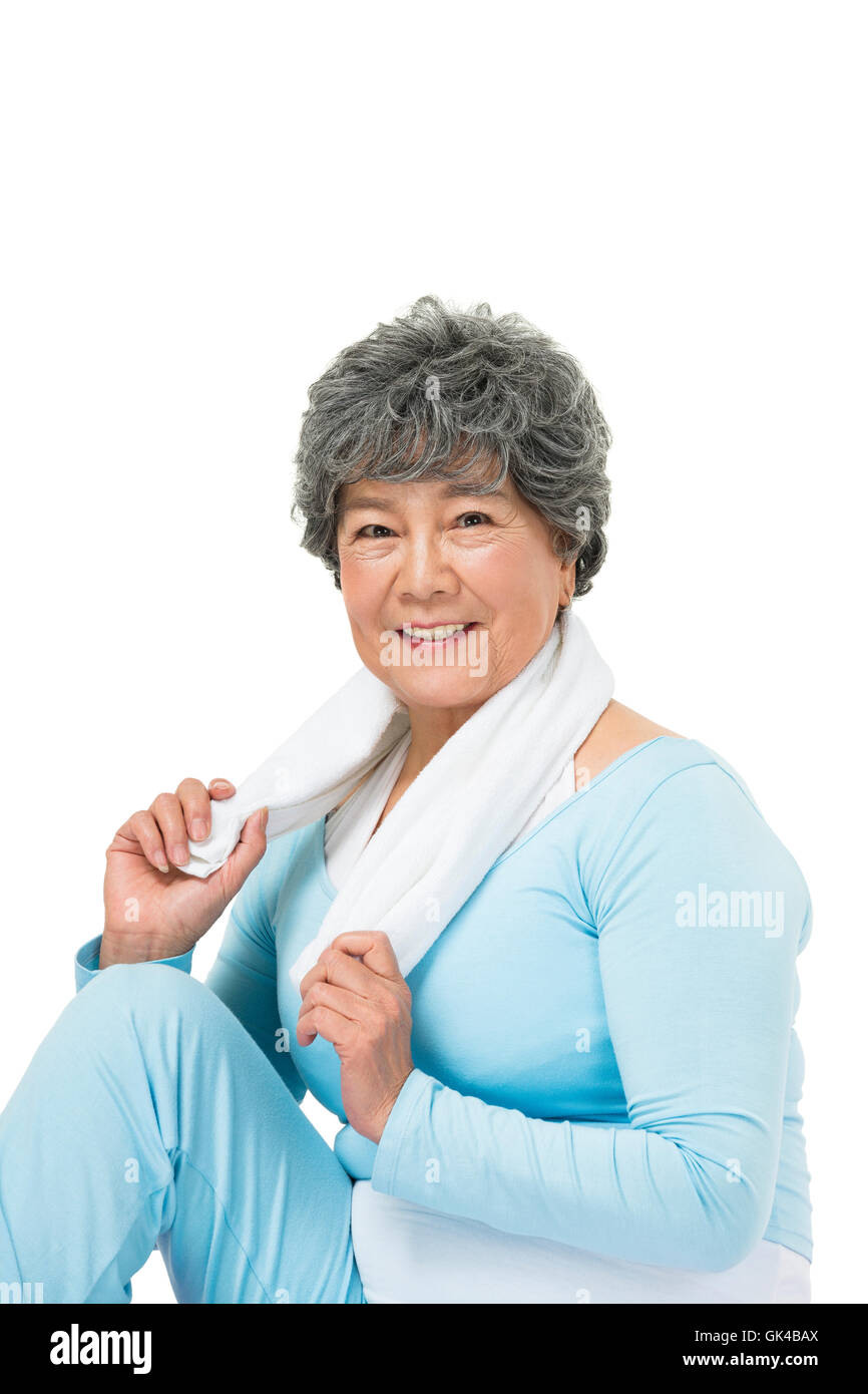 Elderly woman sitting on yoga mat Stock Photo Alamy