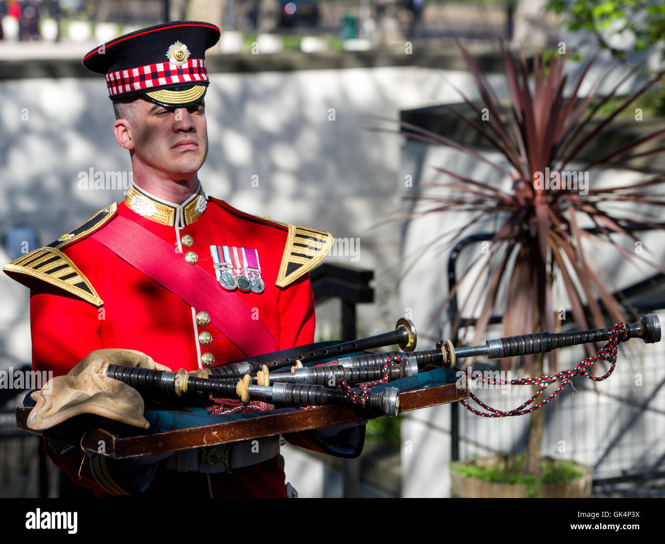 Will Casson-Smith, Warrant Officer, First Class Band Master accompanied by Piper John Mitchell, lay a set of 100-year-old bagpipes belonging to Pipe Major William Lawrie of the Argyll and Sunderland Regiment in the Chapel of Wellington Barracks. Major Law Stock Photo