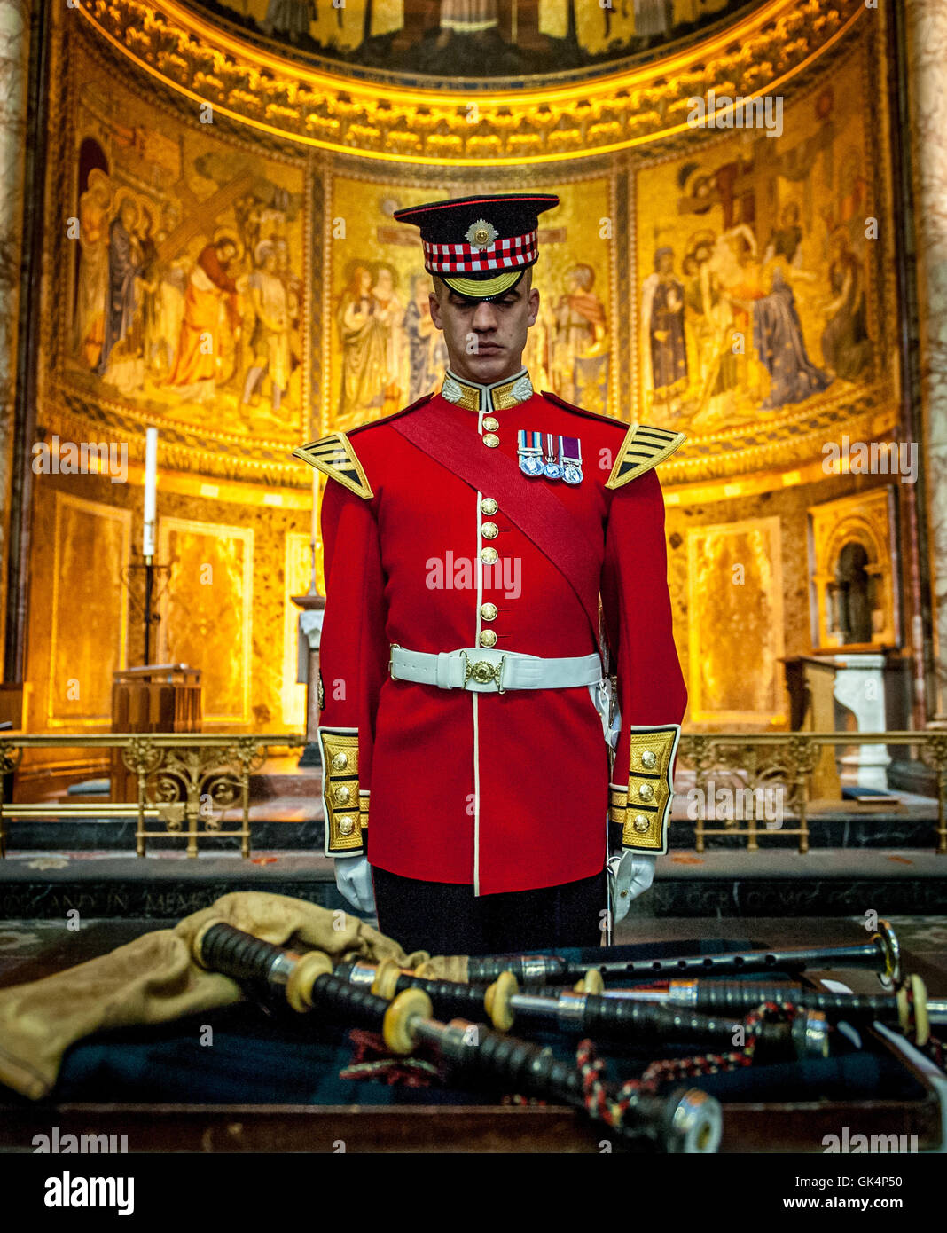 Will Casson-Smith, Warrant Officer, First Class Band Master accompanied by Piper John Mitchell, lay a set of 100-year-old bagpipes belonging to Pipe Major William Lawrie of the Argyll and Sunderland Regiment in the Chapel of Wellington Barracks. Major Law Stock Photo