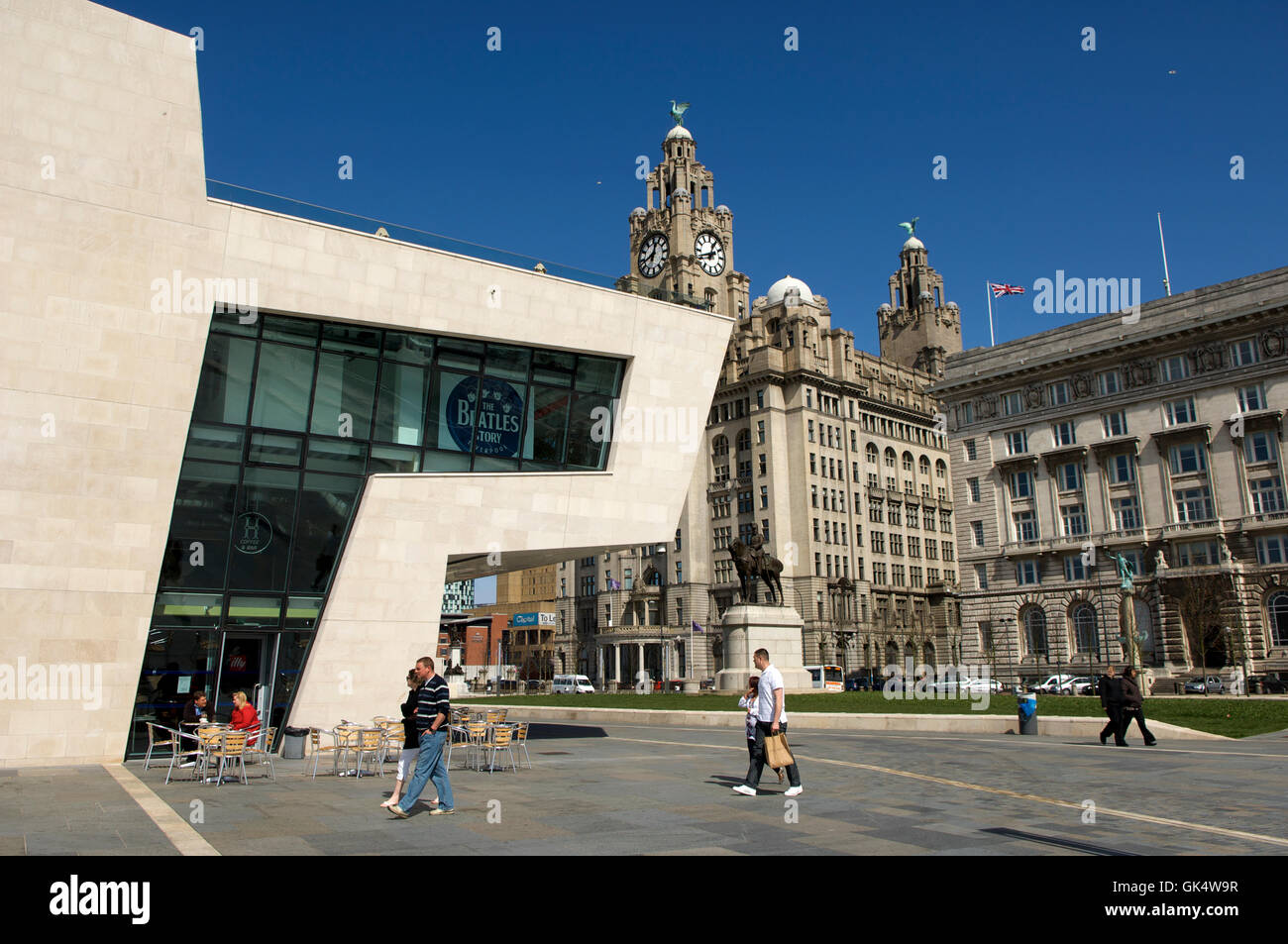 Liverpool, Merseyside, England, UK --- The Beatles Musem, promenade and the Liver Building (at rear). Liverpool, Merseyside, Uni Stock Photo