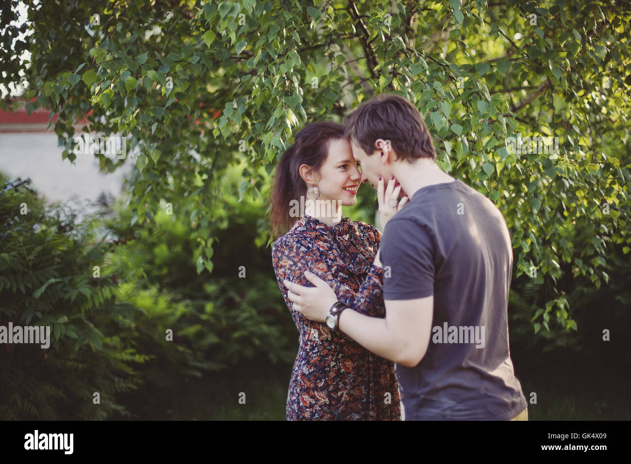 Happy couple in love walking in park Stock Photo - Alamy