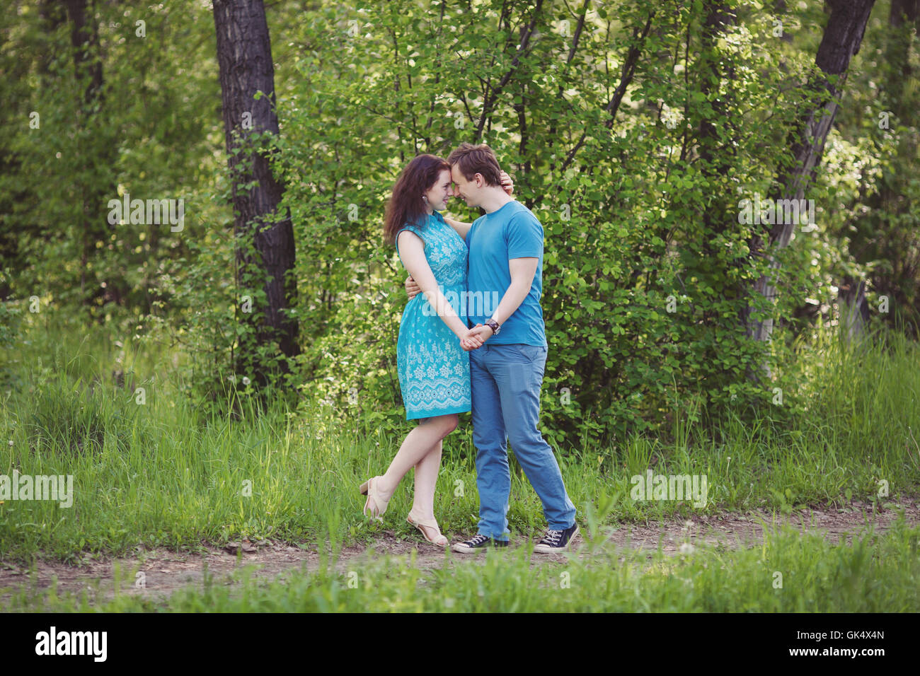 Happy couple in love walking in park Stock Photo - Alamy