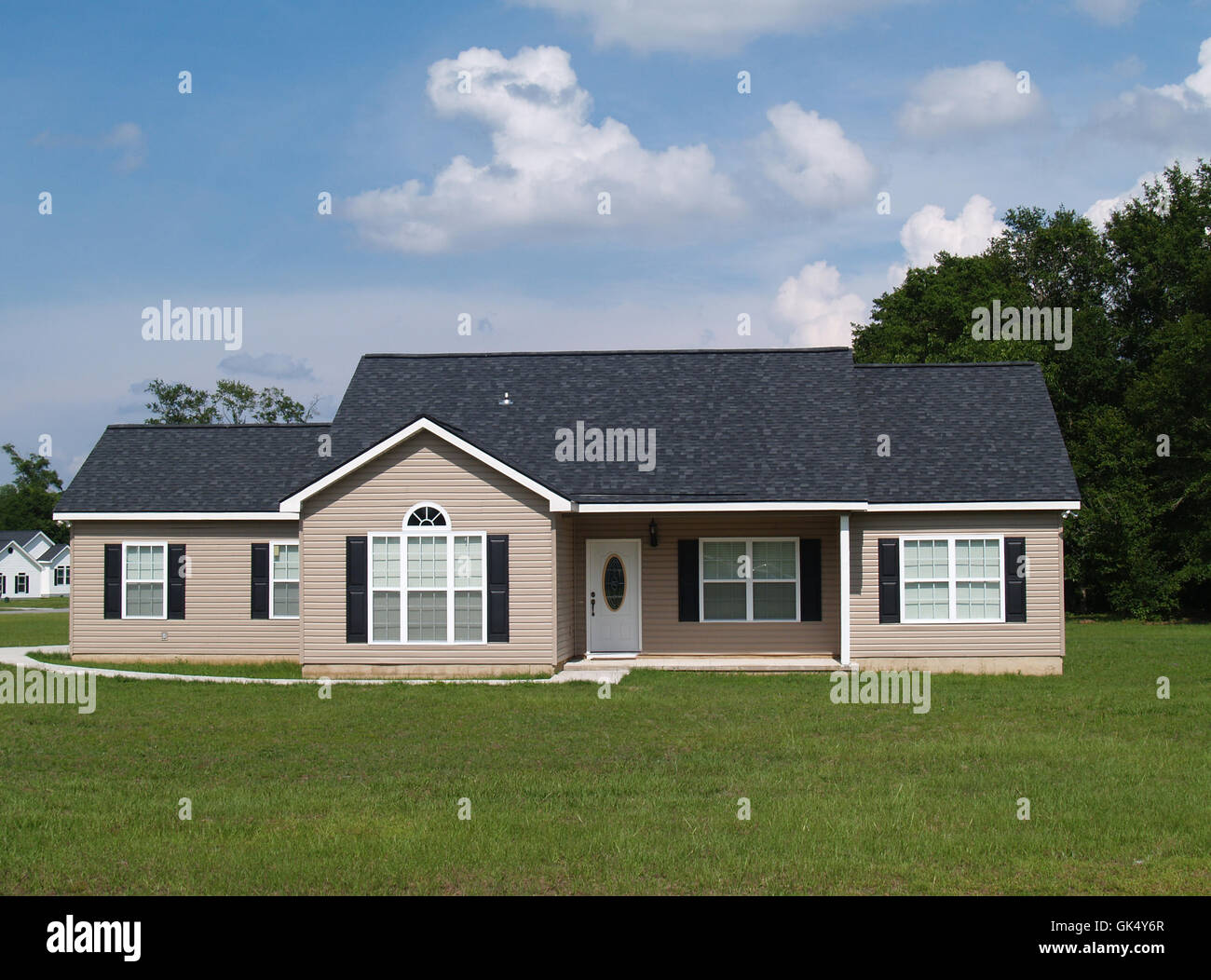 Small tan house black shutters hi res stock photography and images