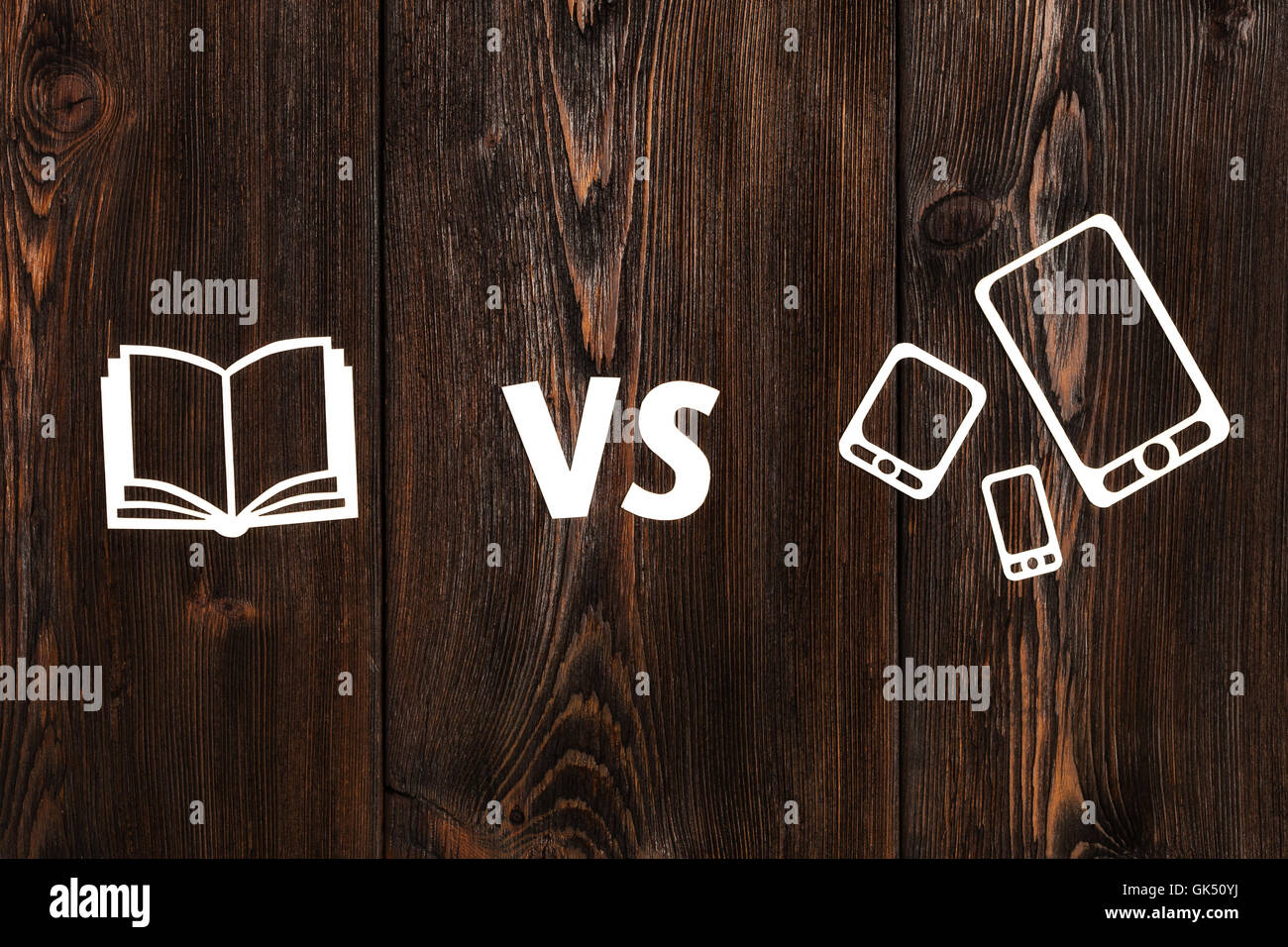 Book vs ebook or pad. Abstract paper conceptual image Stock Photo Alamy