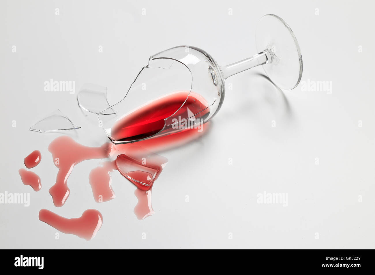 Broken Red Wine tasting glass with wine Stock Photo Alamy