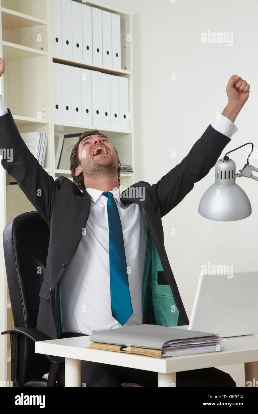 Businessman cheering desk hi-res stock photography and images - Alamy