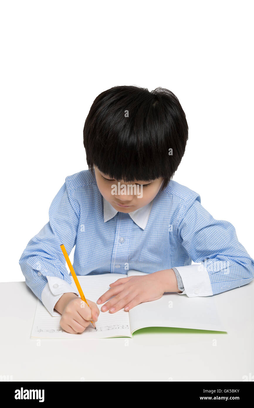 The little boy was writing Stock Photo - Alamy