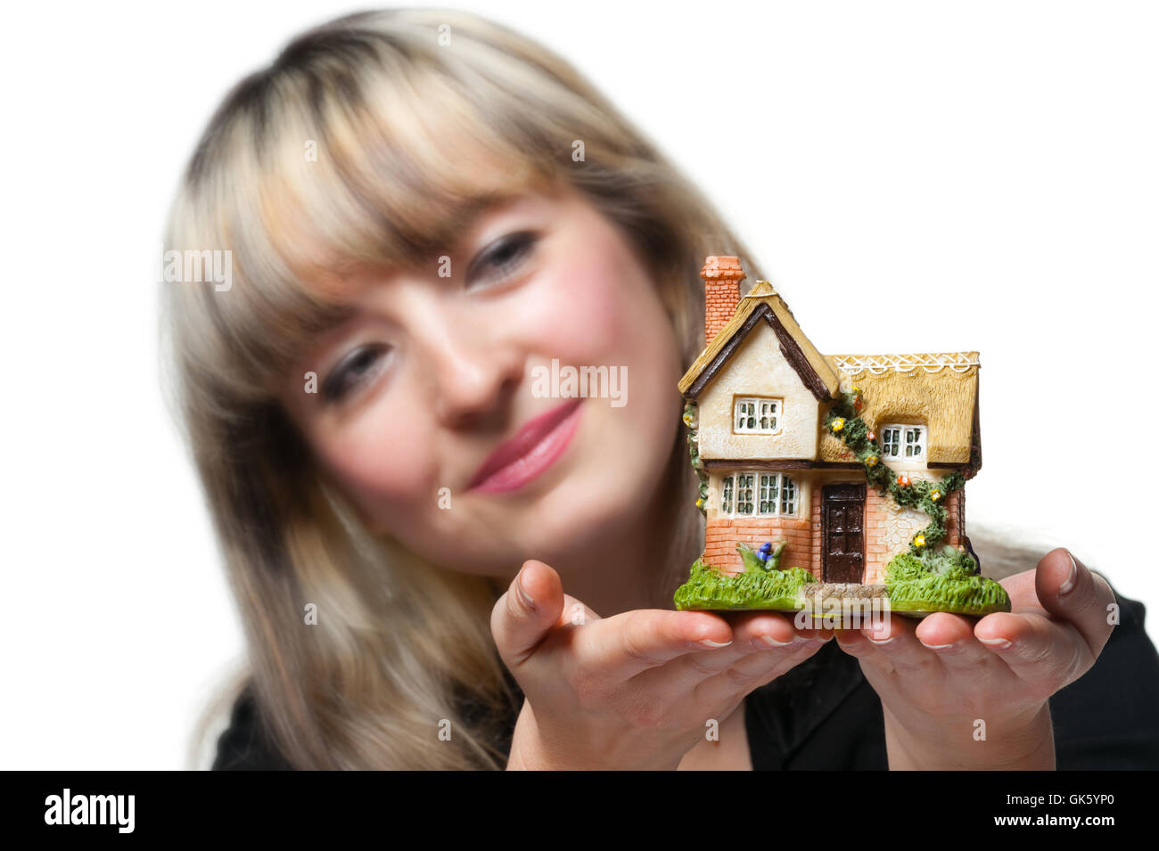 The business woman holds the small house in the hands Stock Photo - Alamy