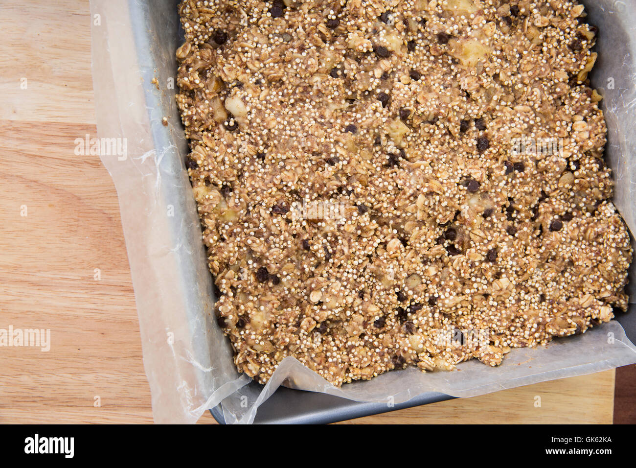 Baking pan full of quinoa and oat bars dough ready for baking Stock Photo