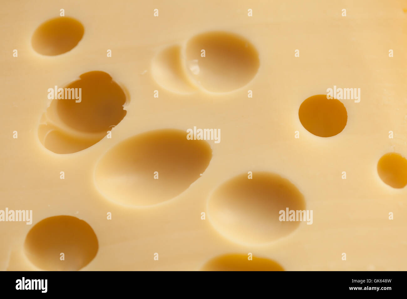 Cheese with holes Stock Photo Alamy