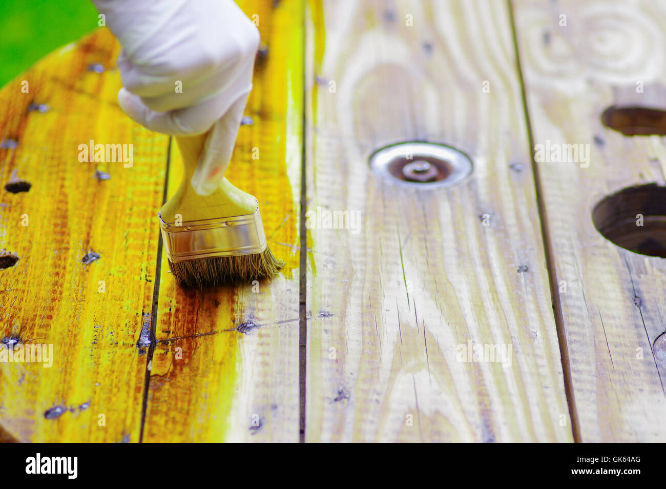 hand applying lacquer to a wood table with a brush Stock Photo Alamy