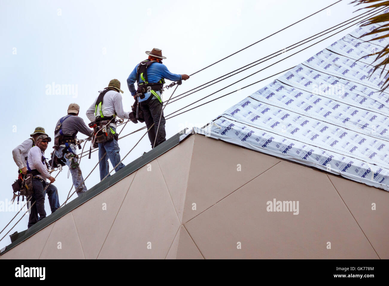 Naples Florida ArtisNaples complex roof repair construction man Stock