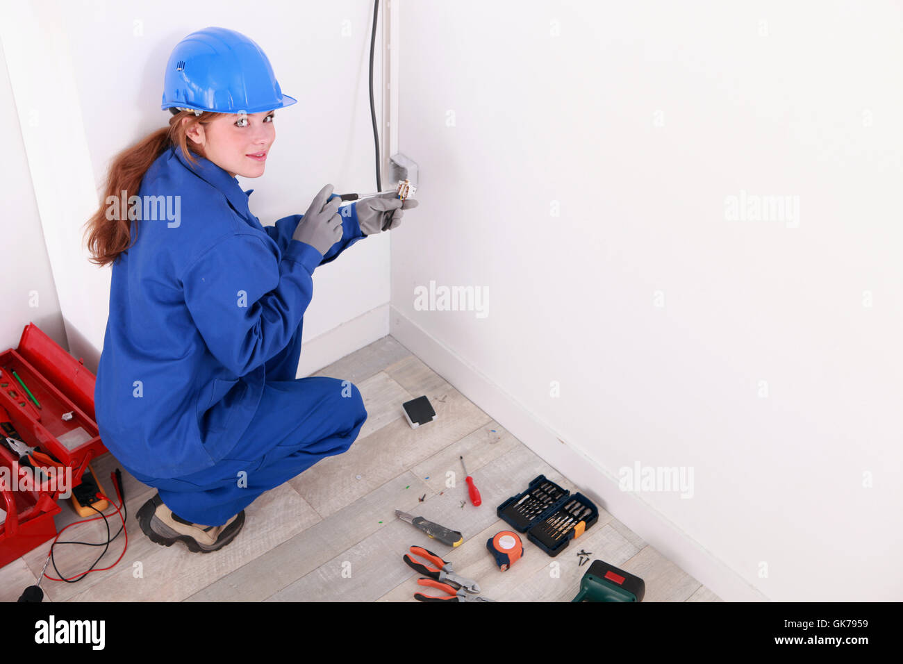 Kneeling woman wearing boots hi-res stock photography and images - Alamy