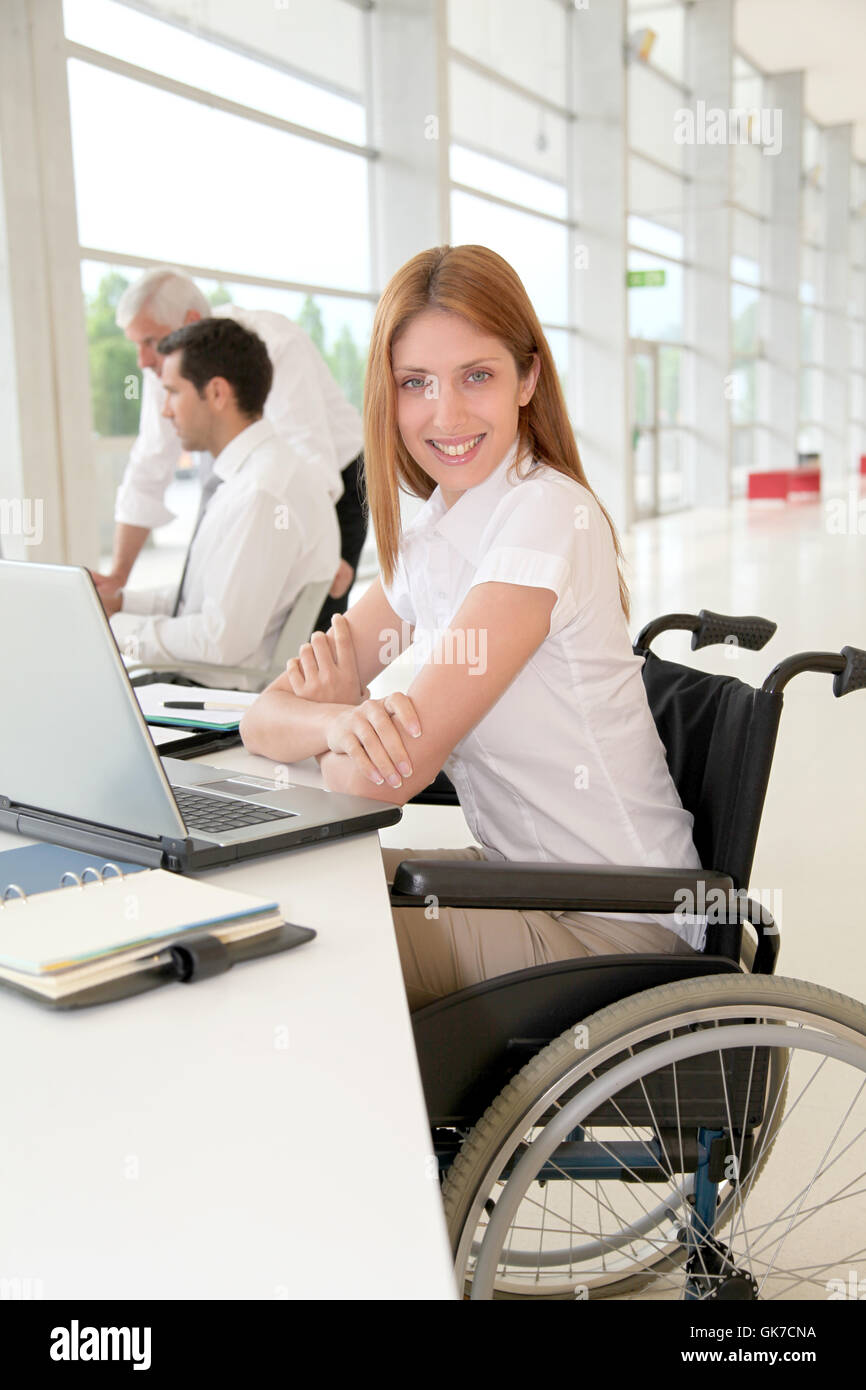 woman wheelchair office Stock Photo - Alamy