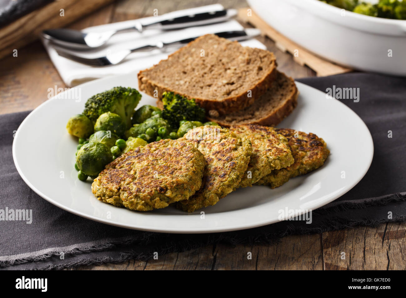 homemade veggie burgers with roasted vegetables and bread. Stock Photo