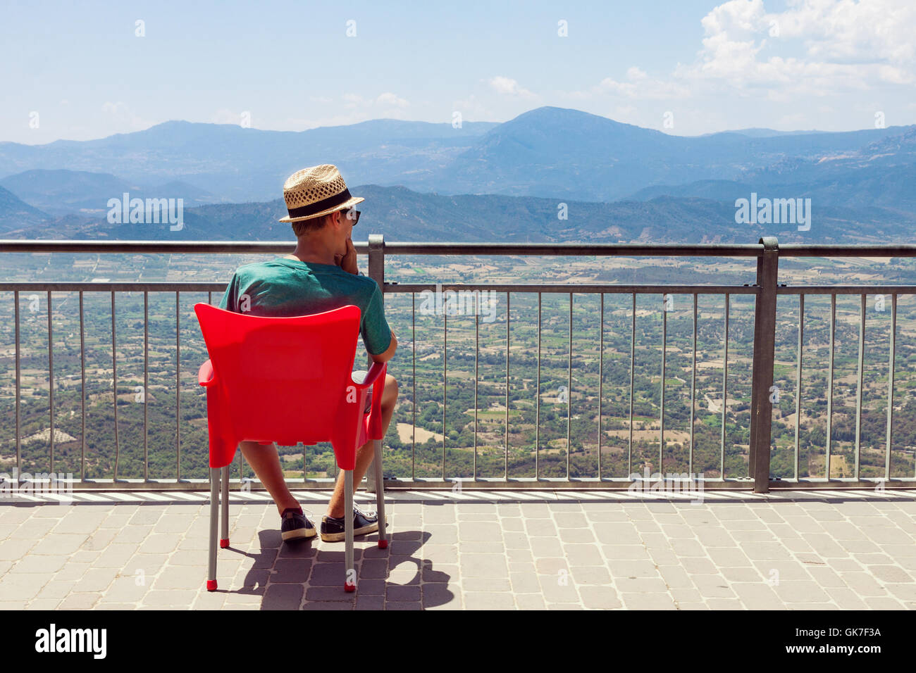 Teenager boy sitting on chair hi-res stock photography and images - Alamy