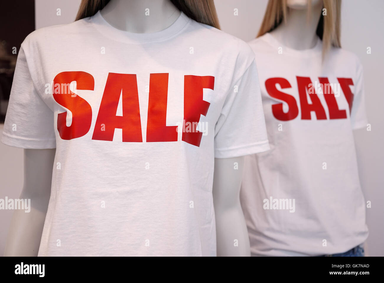 shop window mannequins advertising sale Stock Photo