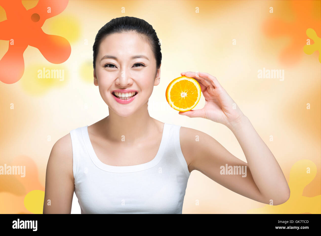 Studio shot happy young woman and fruit Stock Photo - Alamy