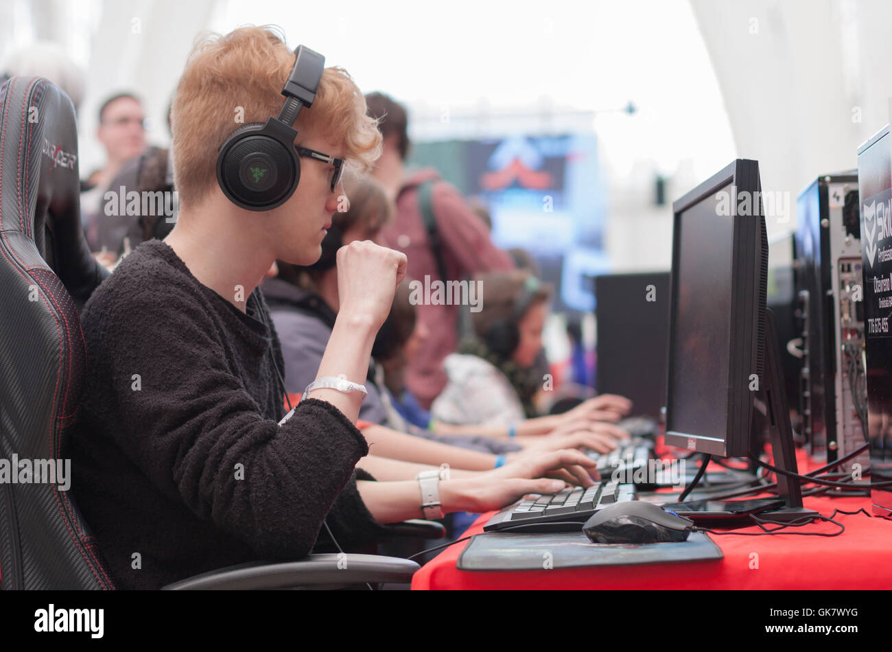 BRNO, CZECH REPUBLIC - APRIL 30, 2016: Young man sits on gaming chair and plays game on PC at Animefest, anime convention Stock Photo