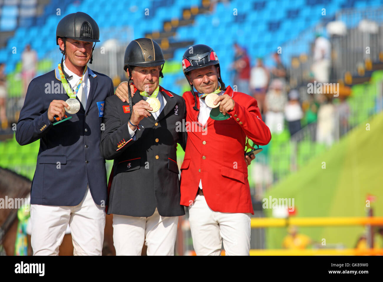 Rio de Janeiro, Brazil. 19th August, 2016. Centre - Nick Skelton GBR, Gold Medal Winner in the Olympic Equestrian Show Jumping  Left - Peder Fredricson of Sweden, the Silver Medal Winner Right - Eric Lamaze of Canada, the Bronze Medal Winner in Rio de Janeiro, Brazil. Stock Photo