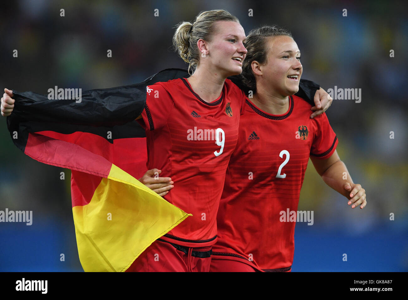Rio de Janeiro, Brazil. 19th Aug, 2016. Alexandra Popp (L) and Josephine Henning of Germany celebrate after winning the Women's soccer Gold Medal Match between Sweden and Germany during the Rio 2016 Olympic Games at the Maracana in Rio de Janeiro, Brazil, 19 August 2016. Photo: Soeren Stache/dpa/Alamy Live News Stock Photo